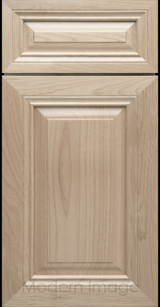 Close-up of a Blondie-stained wood cabinet door with a mitered frame and traditional Cambridge raised center panel.